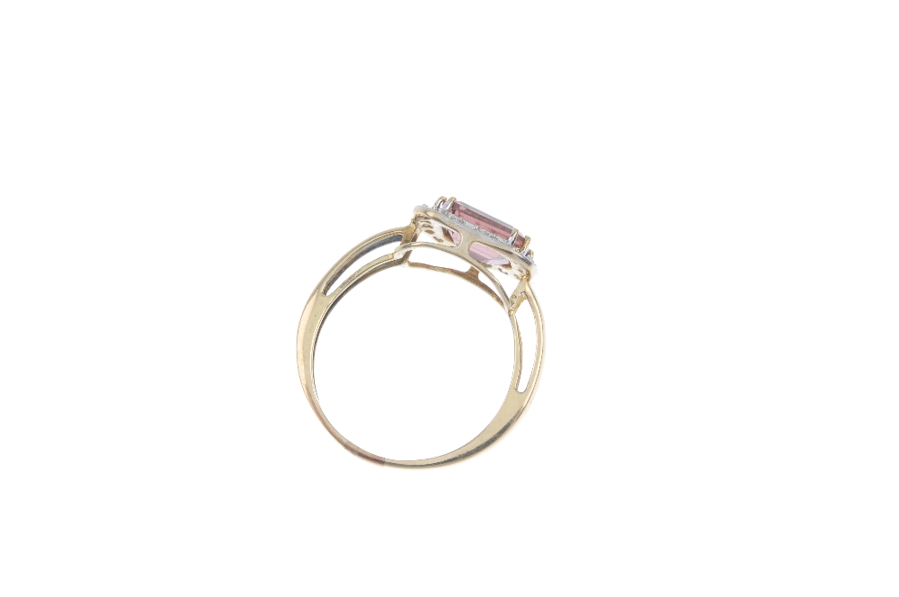 A topaz dress ring. The pink topaz, within a brilliant-cut diamond surround, to the tapered band. - Image 3 of 3