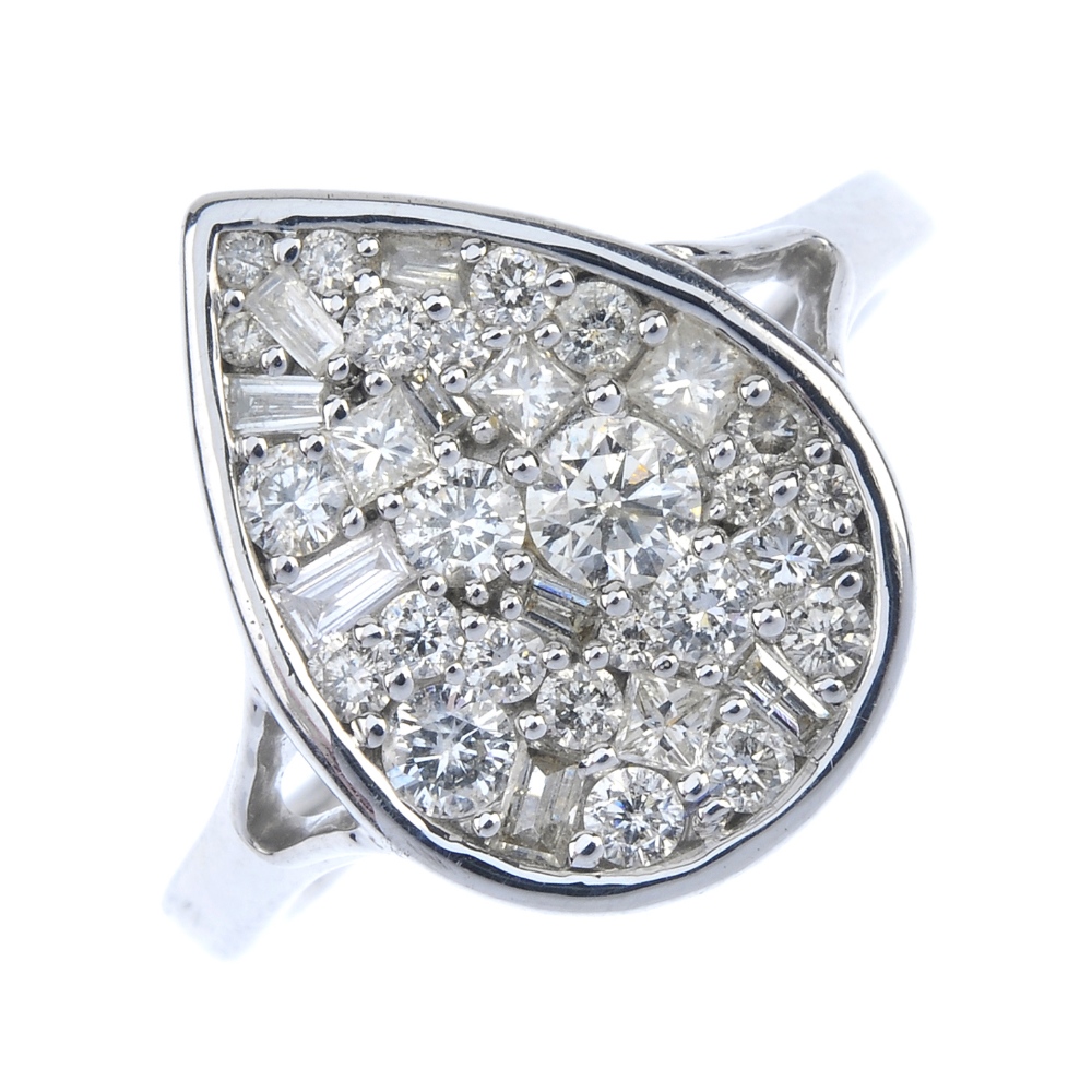 A diamond cluster ring. Of pear-shape outline, the vari-cut diamond cluster, to the plain band.