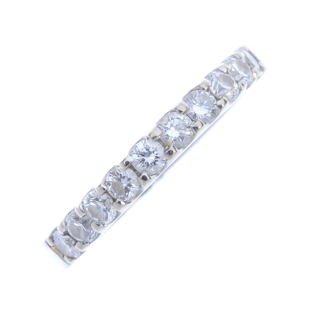 A diamond half-circle eternity ring. The brilliant-cut diamond line, to the plain half-band.
