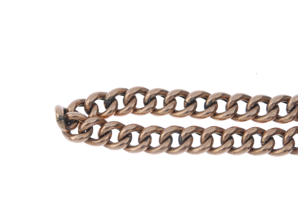 An early 20th century 9ct gold bracelet. The curb-link chain, to the heart-shape padlock clasp. - Image 2 of 3