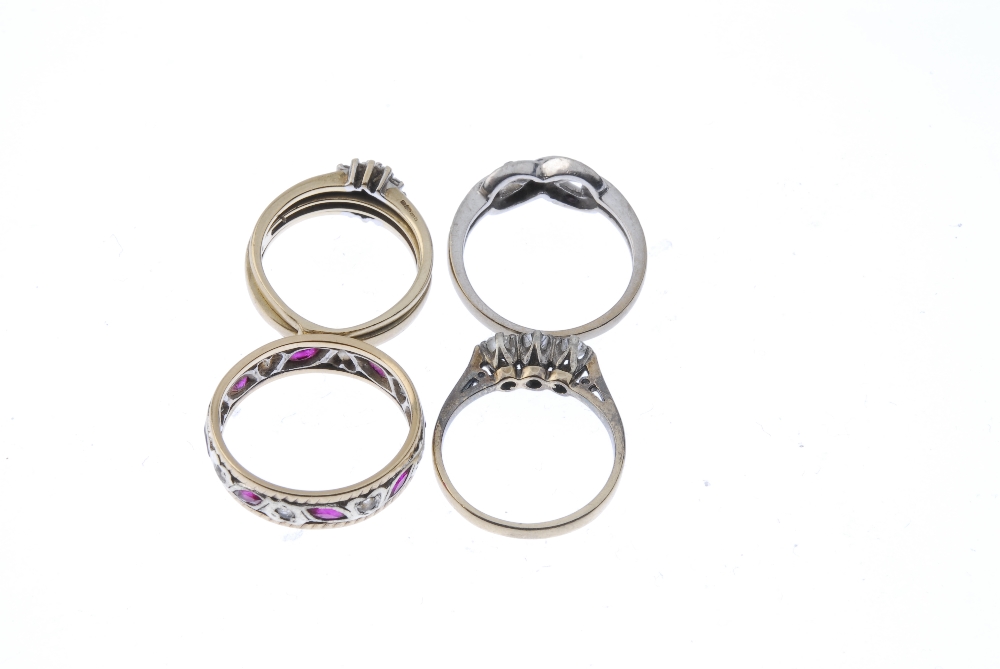 A selection of four 9ct gold gem-set rings. To include a diamond three-stone ring, a diamond cluster - Image 3 of 3