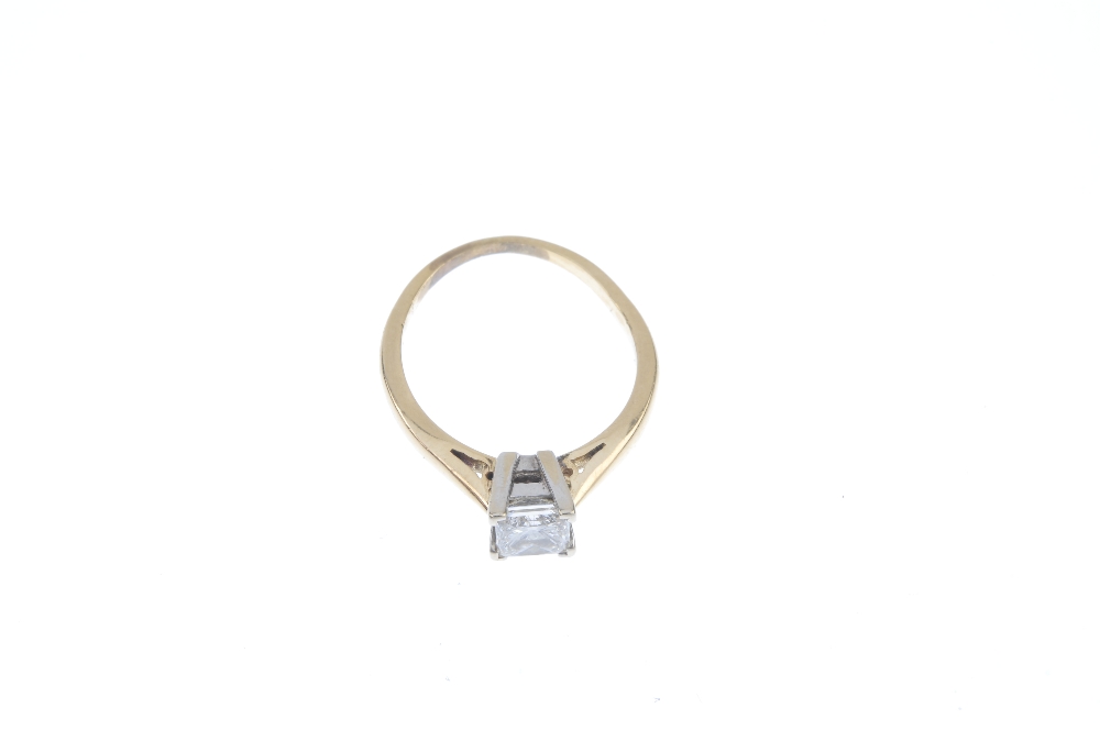 A diamond single-stone ring. The square-shape diamond, to the tapered shoulders and plain band. - Image 2 of 3