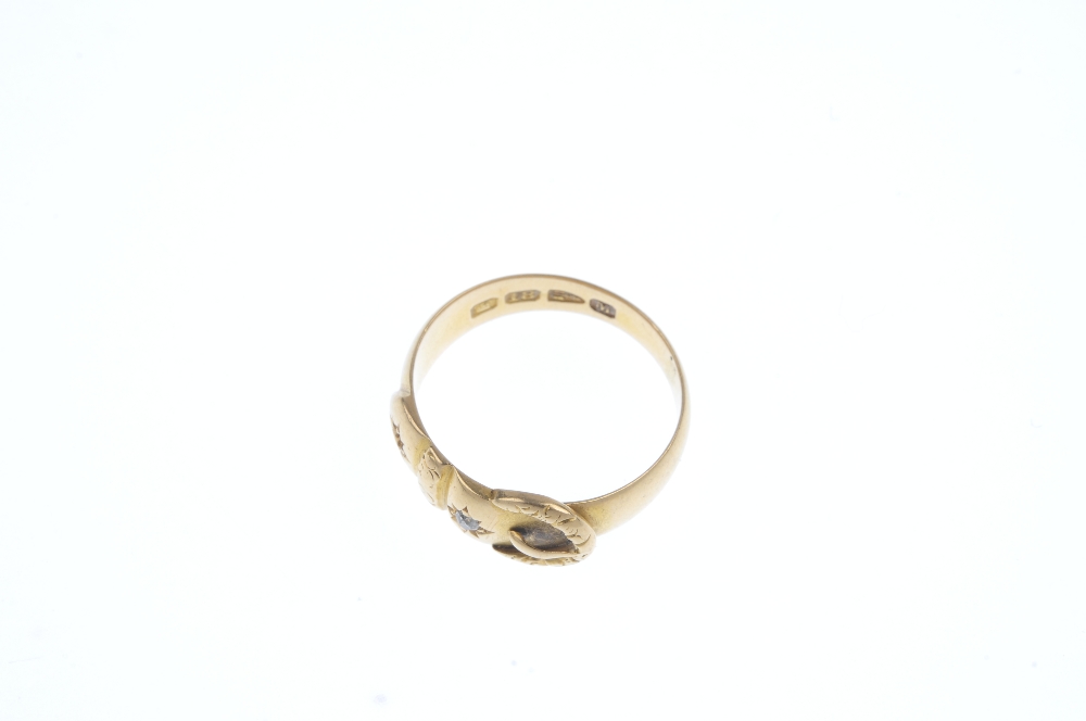 A late Victorian 18ct gold buckle ring. The textured buckle with old-cut diamond accents. One - Image 2 of 3
