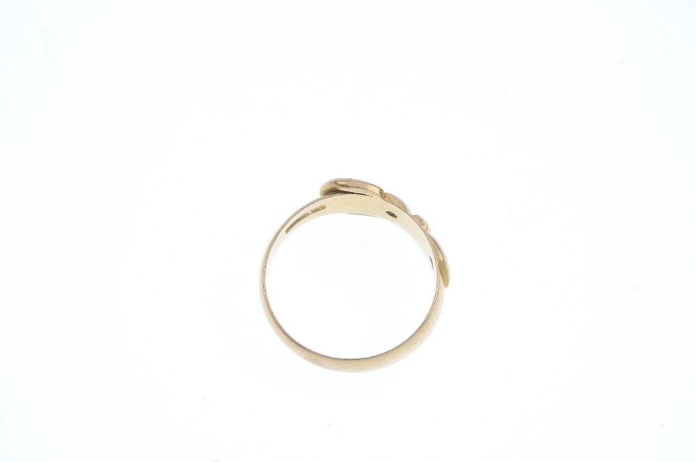 A late Victorian 18ct gold buckle ring. The textured buckle with old-cut diamond accents. One - Image 3 of 3