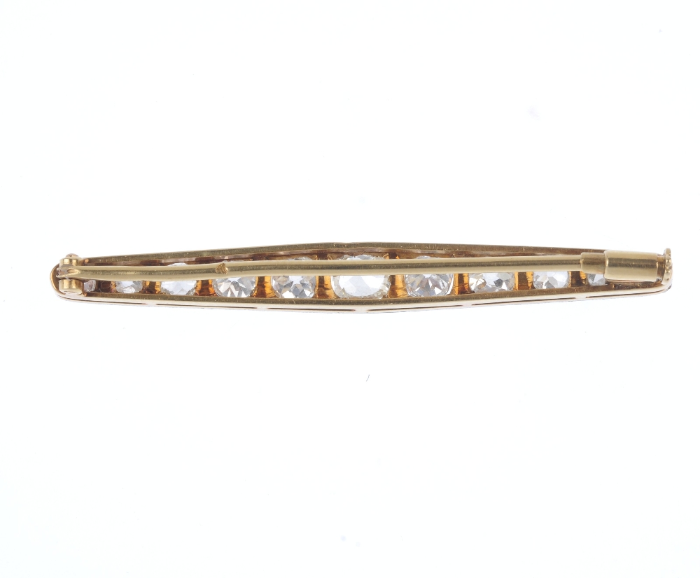 A mid 20th century diamond bar brooch. The graduated old-cut diamond line, within a bi-colour mount. - Image 2 of 2