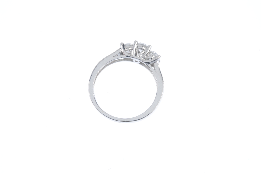 An 18ct gold diamond three-stone ring. The brilliant-cut diamond stepped line, with similarly-cut - Image 3 of 3