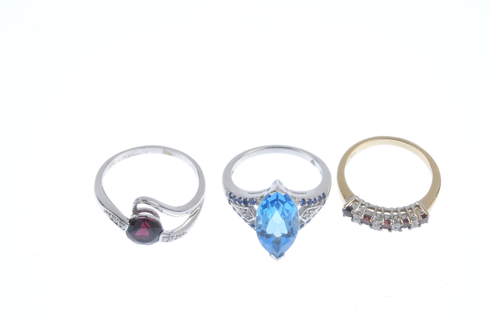 A selection of three 9ct gold gem-set rings. To include a garnet and colourless gem half-circle - Image 2 of 3