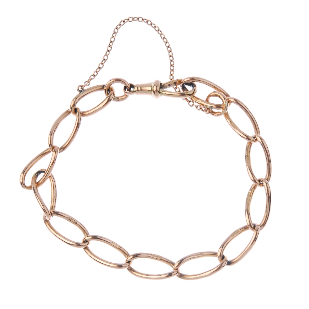 A 9ct gold bracelet. The curb-link chain, to the sprung-clasp, with safety-chain. Hallmarks for