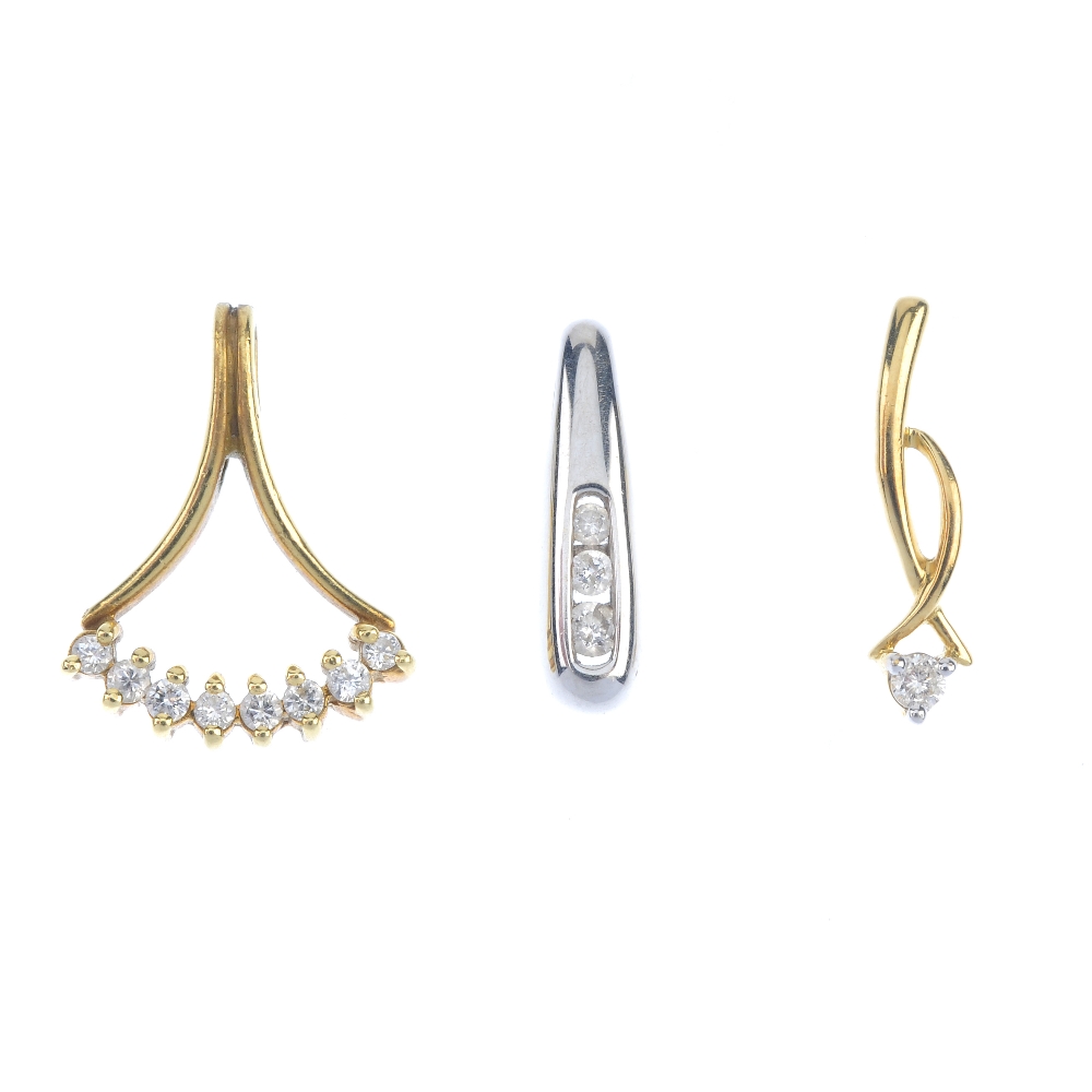 A selection of three diamond pendants and one ear pendant. To include an 18ct gold graduated