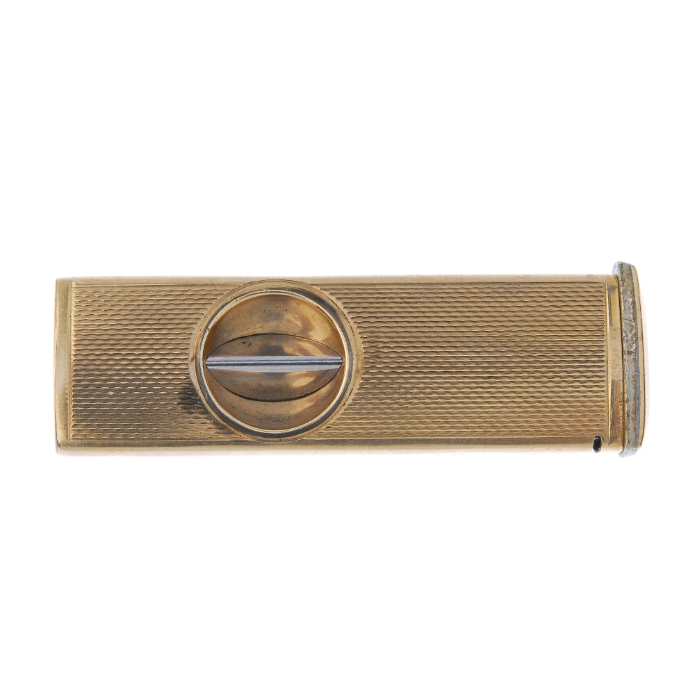 A 9ct gold cigar cutter. With engine turned case. Hallmarks for Birmingham, 1964. Length 5.5cms.