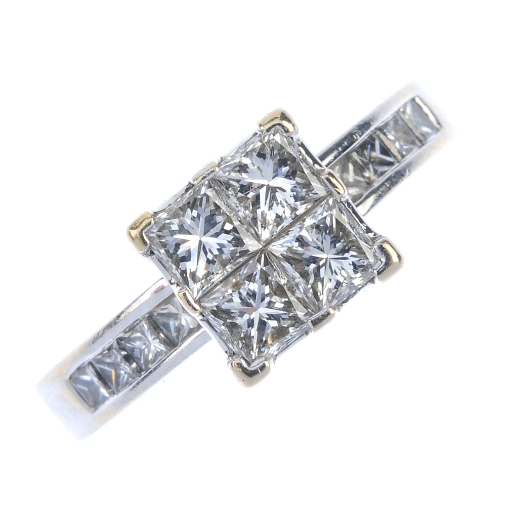 An 18ct gold diamond dress ring. The square-shape diamond panel, with square-shape diamond line
