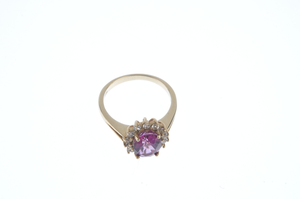 A 9ct gold coated topaz and diamond cluster ring.The oval-shape pink coated topaz and brilliant- - Image 2 of 3