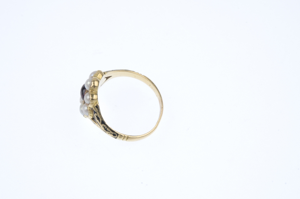An early 19th century 18ct gold memorial ring. Designed as a central oval-shape cabochon garnet, - Image 3 of 4