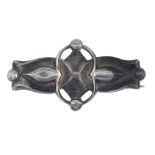 LIBERTY & CO. - an early 20th century silver brooch. Designed as an abstract flower, with