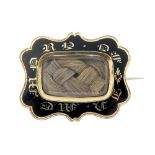 A late 19th century gold enamel mourning brooch. The rectangular-shape woven hair panel, within a