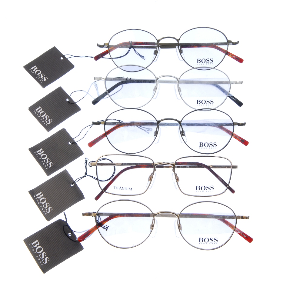 HUGO BOSS - five pairs of glasses. Four of the same design, differing in colour, featuring thin
