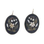 A pair of pietra dura earrrings. Designed as oval-shape onyx panels with inlaid hardstone flowers