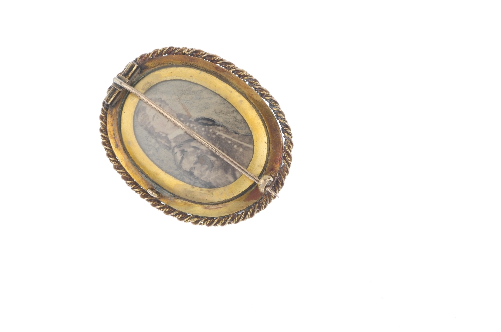 A late 19th century gold split pearl and onyx mourning brooch. The oval-shape onyx cabochon with a - Image 2 of 2