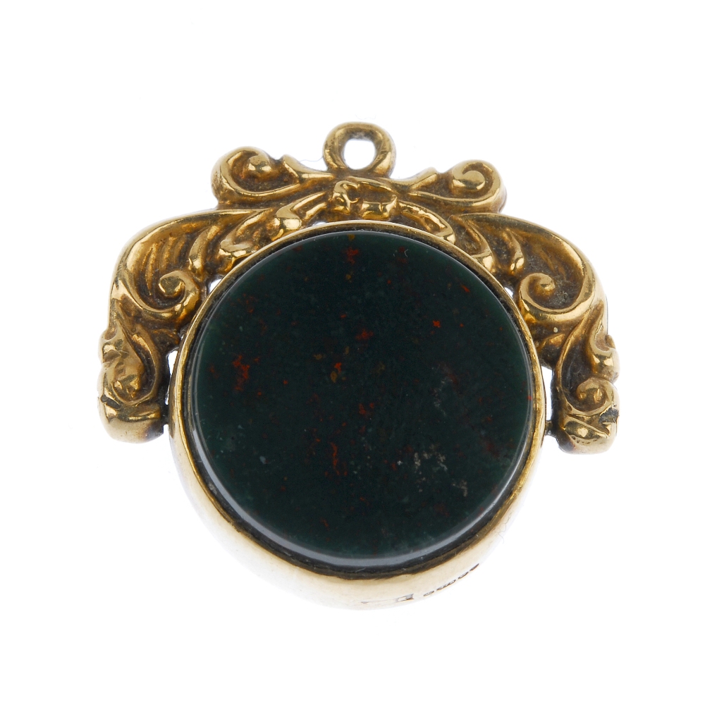 Three hardstone swivel fobs. To include an early 20th century 9ct gold bloodstone and monogram