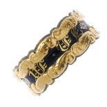 An early 19th century 18ct gold memorial ring. Designed as a central band of text with black