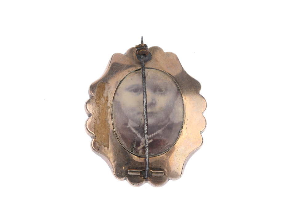 A mid Victorian enamel memorial brooch, circa 1870. The split pearl forget-me-not, atop a black - Image 2 of 2