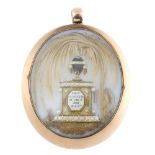 A George III gold memorial pendant. Of oval-shape outline, the opalescent glass panel with applied