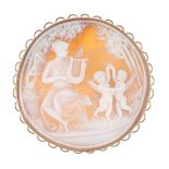 A 9ct gold cameo. Of circular outline, the cameo depicting a winged lady playing a lyre for two