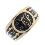 A George III 18ct gold memorial ring. The tapered band with black and white enamel to the monogram