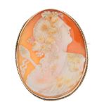 A 9ct gold cameo brooch. The oval-shape cameo carved to depict the God Dionysus, armed with a