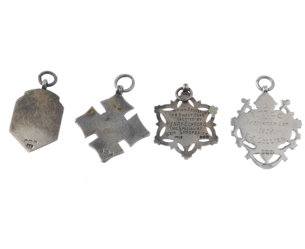 Two Albertinas and four medallions. The three-row Albertinas with tassels and lobster-claw clasps, - Image 2 of 3