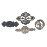 Four late 19th to early 20th century silver brooches. To include an inlaid agate Scottish brooch,