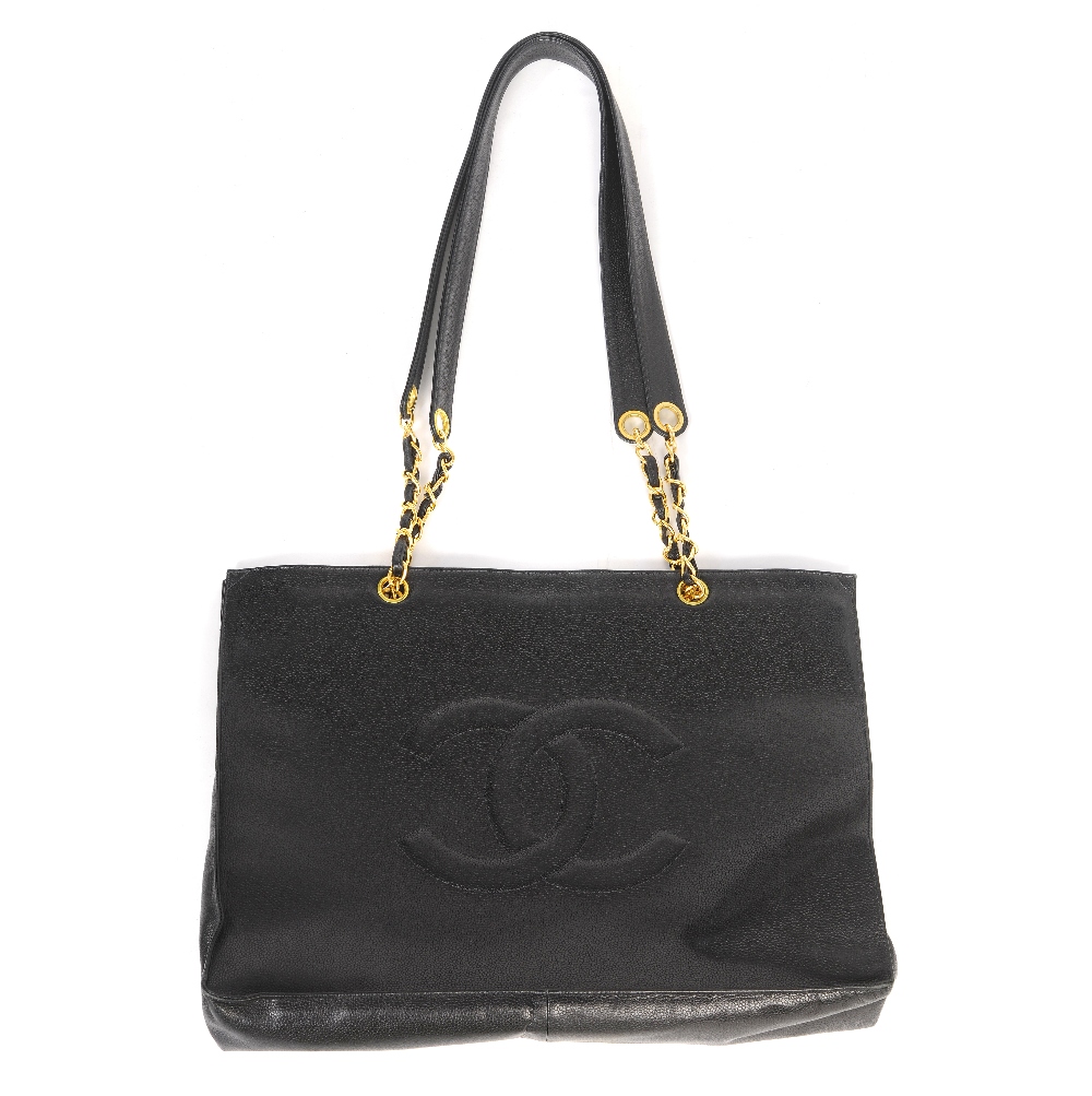 CHANEL - a Caviar Leather CC Shopper. Designed with an open top, pebbled black Caviar leather