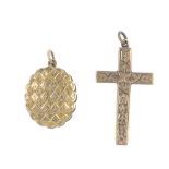 Two items of early 20th century jewellery. The first a cross pendant with scrolling foliate