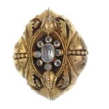 A late Victorian gem memorial brooch. Of oval outline, with applied leaf and bead detail to the