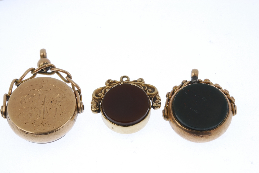 Three hardstone swivel fobs. To include an early 20th century 9ct gold bloodstone and monogram - Image 2 of 2