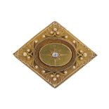 A late Victorian gold and diamond memorial brooch. The diamond outline with overlaid scalloped