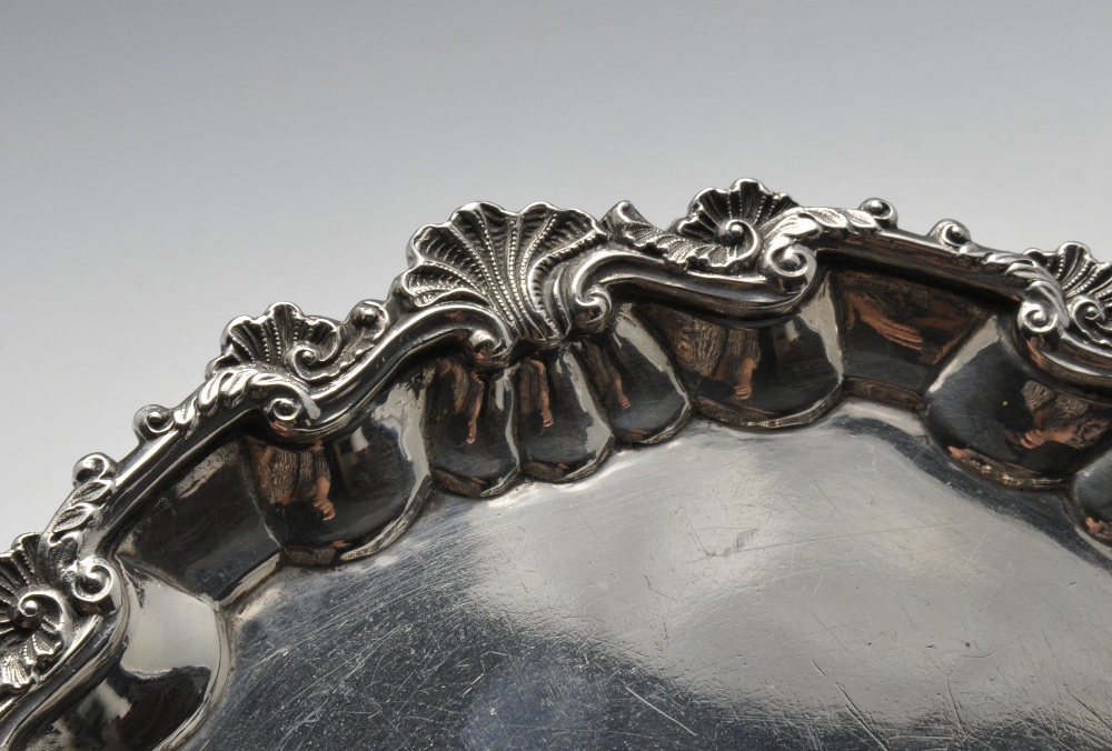 A late George III small silver salver, the circular form with shaped shell and scroll rim to a plain - Image 5 of 6