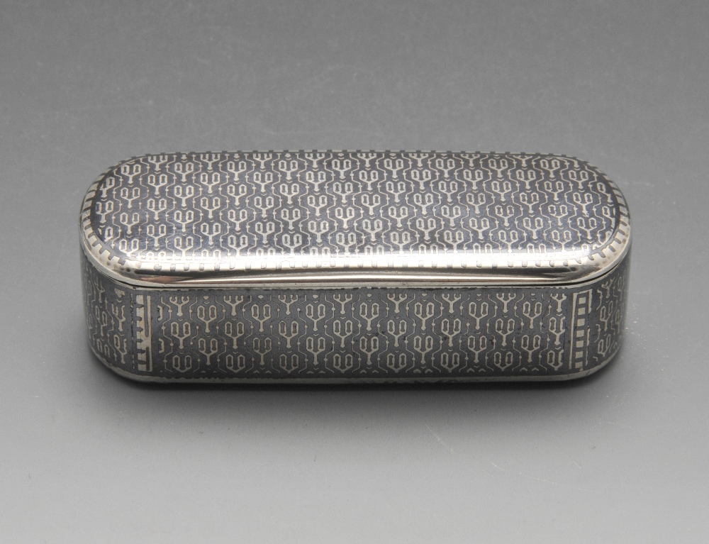 A French silver snuff box, the oblong form entirely decorated in niello with a repeated motif.