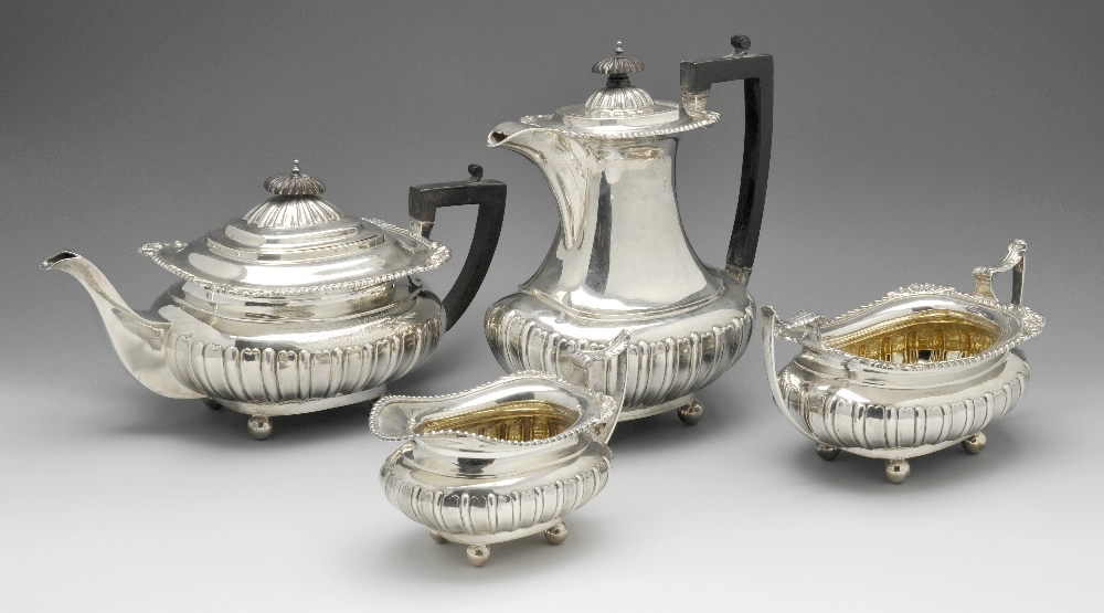 An Edwardian silver four piece tea service comprising teapot, hot water pot, twin-handled sugar bowl