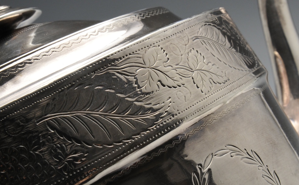 A George III silver three piece silver tea service, the oval form engraved with foliate fruiting - Image 4 of 7