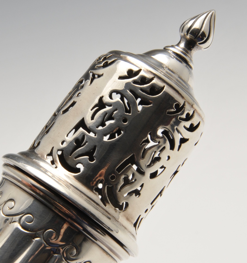 A late Victorian silver caster, of fluted pear form having pierced cover and flame finial, raised - Image 3 of 5