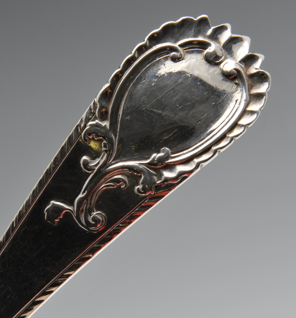 An early George III silver toddy ladle with feather edge and vacant scrolled cartouche to - Image 4 of 5