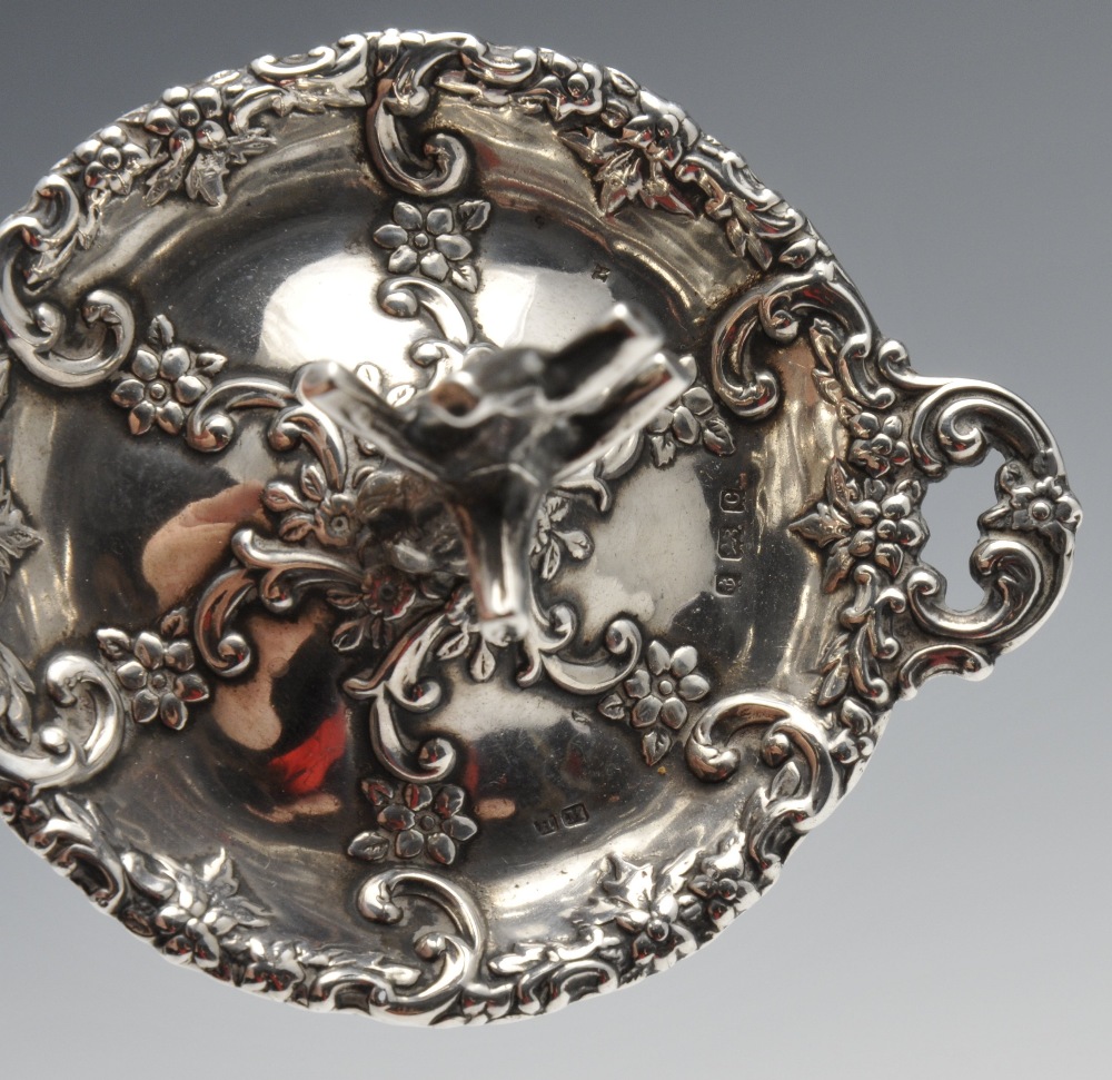 An Edwardian silver ring tree, the twin-handled circular form decorated with floral scrolls and - Image 2 of 4