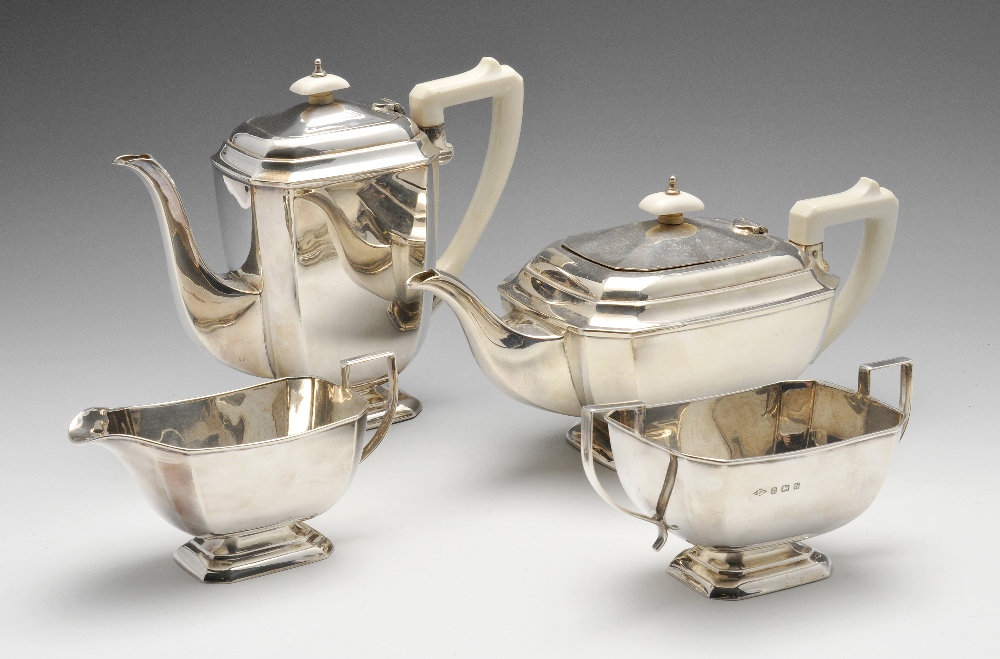 A 1930's four piece silver tea service, of plain chamfered form with angular handle and raised