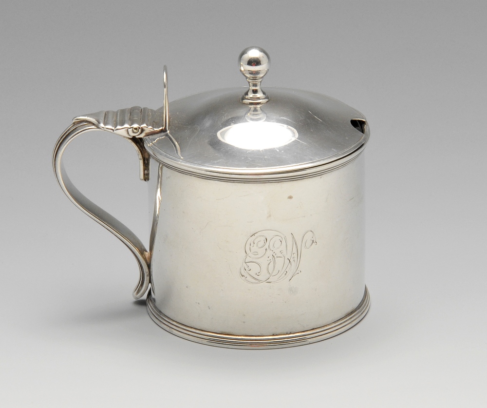 A George III silver mustard pot with blue glass liner, of plain cylindrical form with reeded rims,