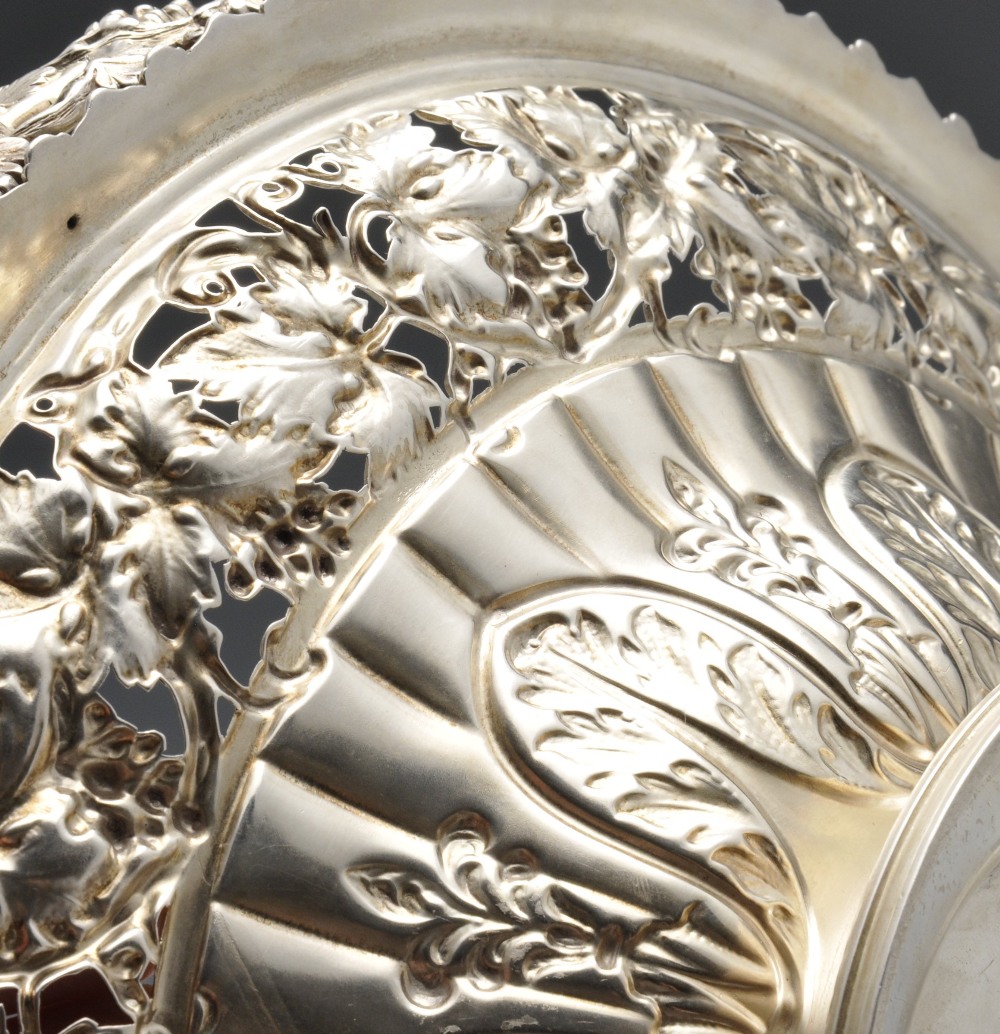 A George IV silver swing handle basket, the circular form fluted and rising to an openwork vine - Image 6 of 6