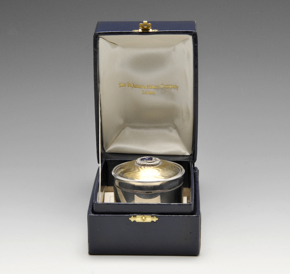 A modern silver musical jewellery or trinket box, the cylindrical with silver-gilt engine-turned