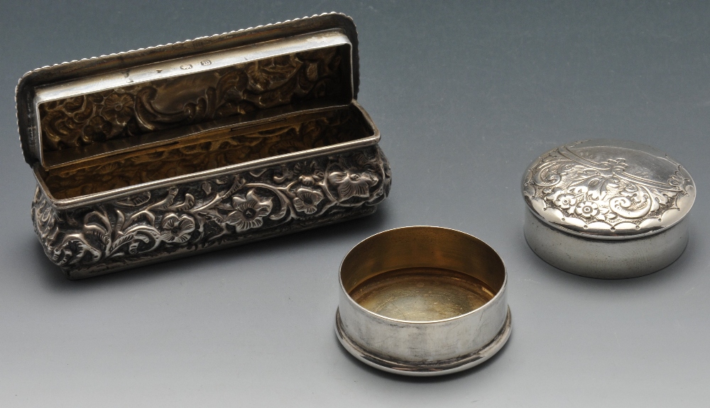 A late Victorian small silver box of oblong form, ornately embossed with floral and foliate - Image 2 of 8