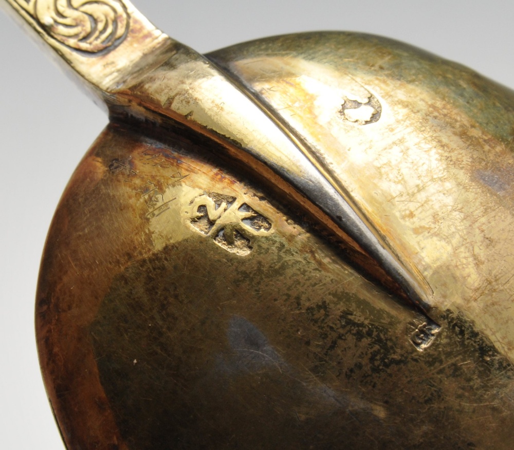 An Edwardian imported replica silver-gilt Trefid spoon with foliate engraved stem with stylised - Image 3 of 8