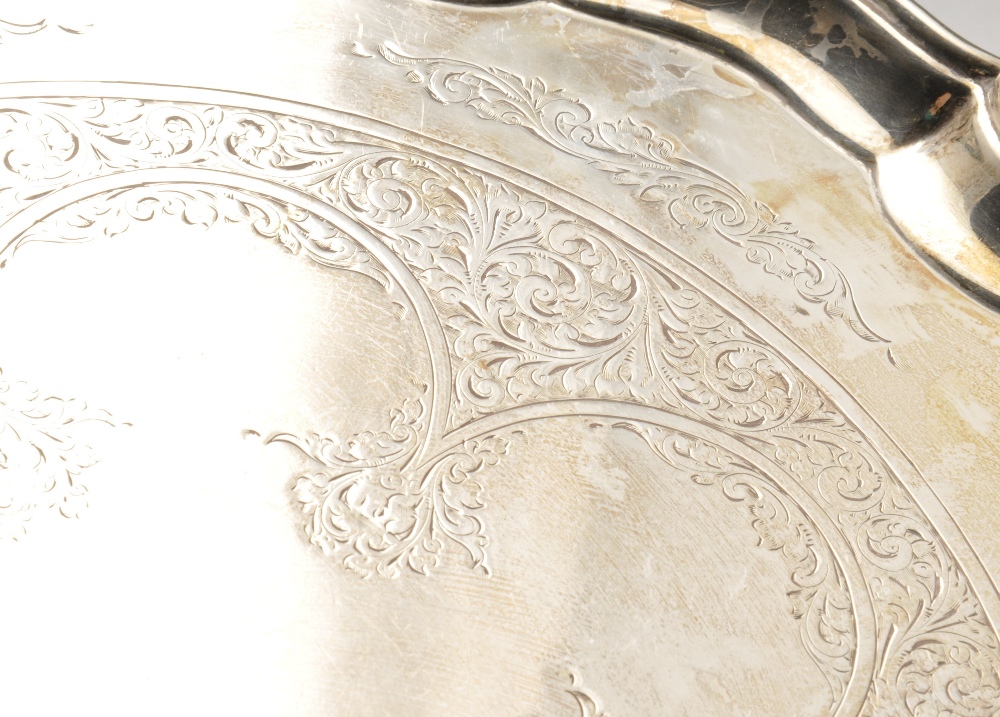 A 1920's silver salver, decorated with a lobed foliate scrollwork panel to centre within a raised - Image 3 of 4